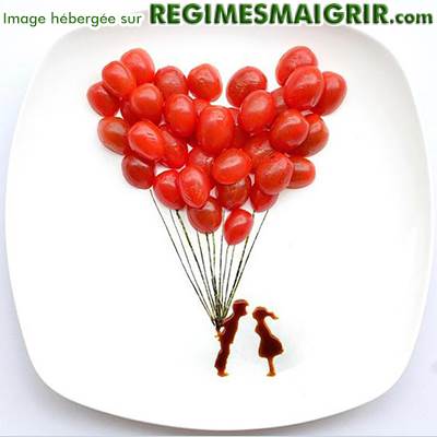 Des ballons en canneberges avec un couple dessin en chocolat